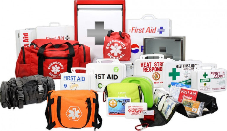 Variety of first aid kits and emergency supplies including bags, guides, and equipment for medical assistance.