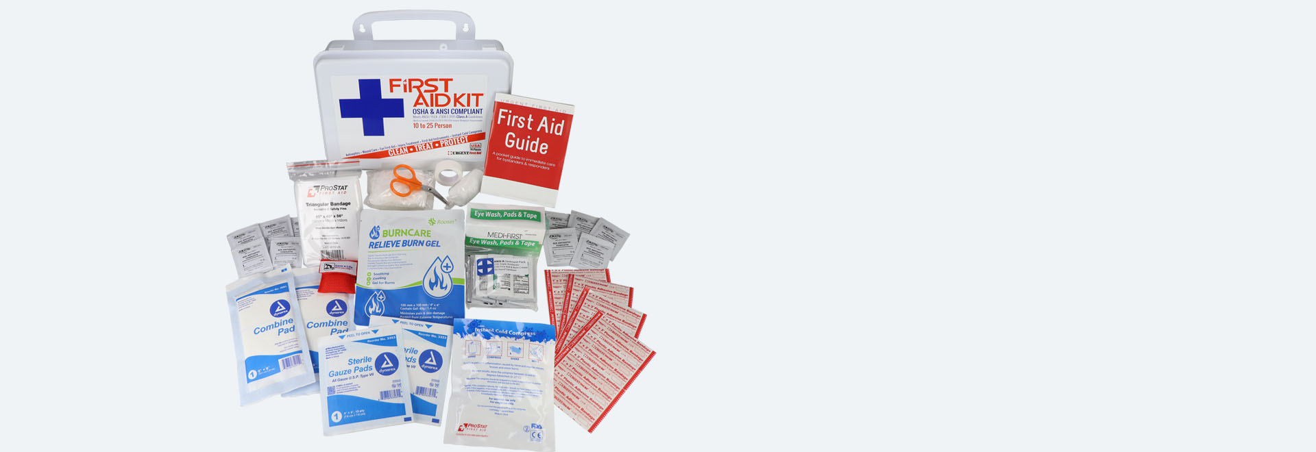 An organized first aid kit containing essential supplies and a first aid guide for emergency situations.