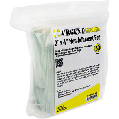 Non-adherent pad package partially opened to show sterile cotton dressing for wound protection